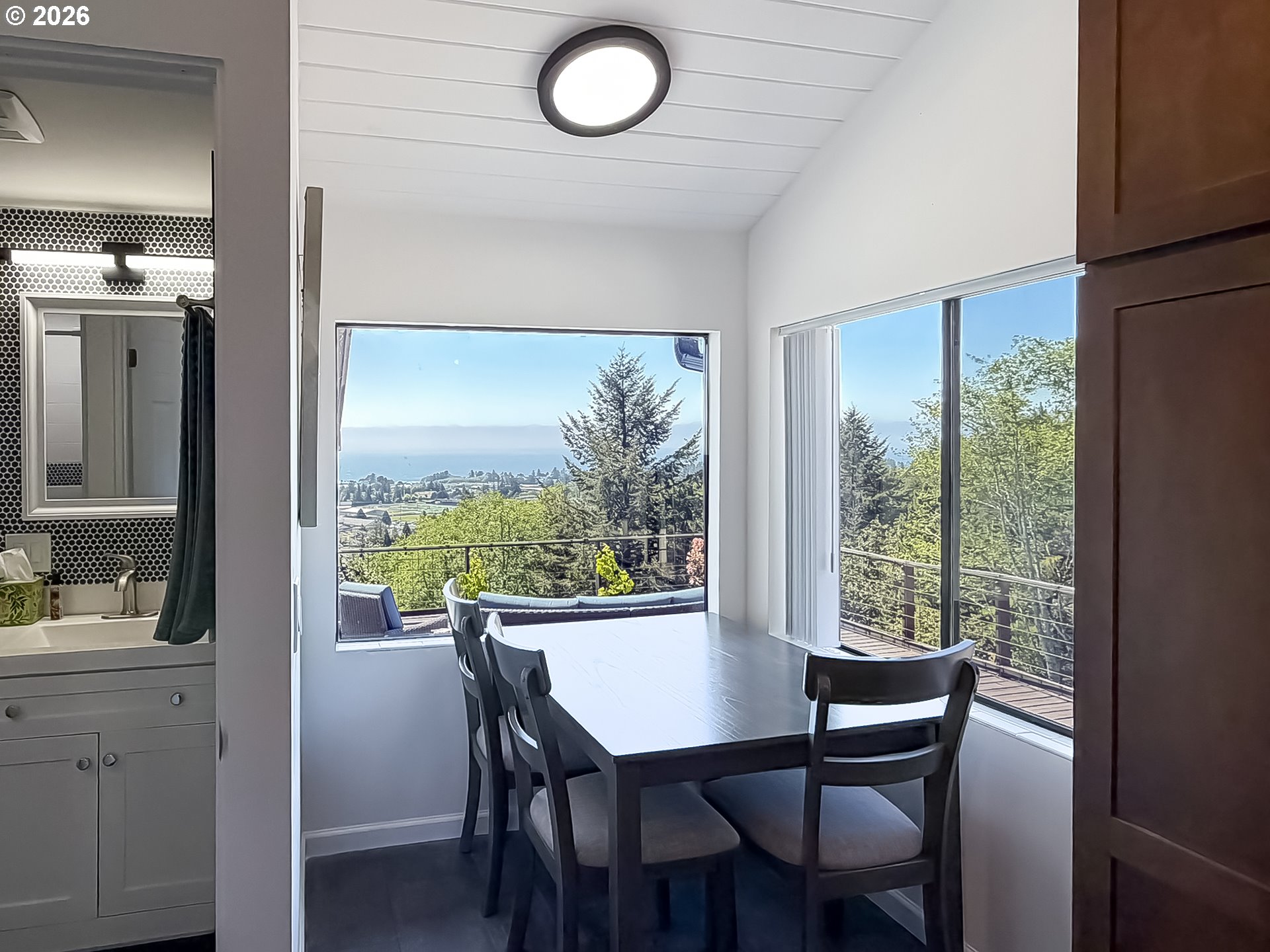 895 Marina Heights Road Brookings, OR 97415 - Photo 38 of 48 a view of a dining room with furniture window and outside view