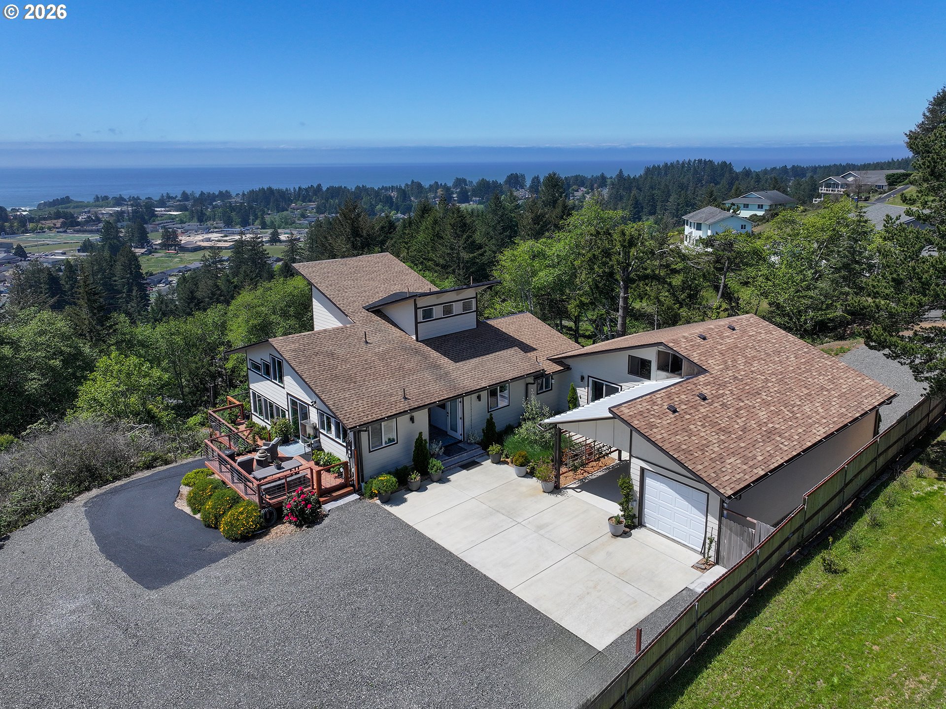 895 Marina Heights Road Brookings, OR 97415 - Photo 8 of 48 an aerial view of a house with a garden and outdoor space