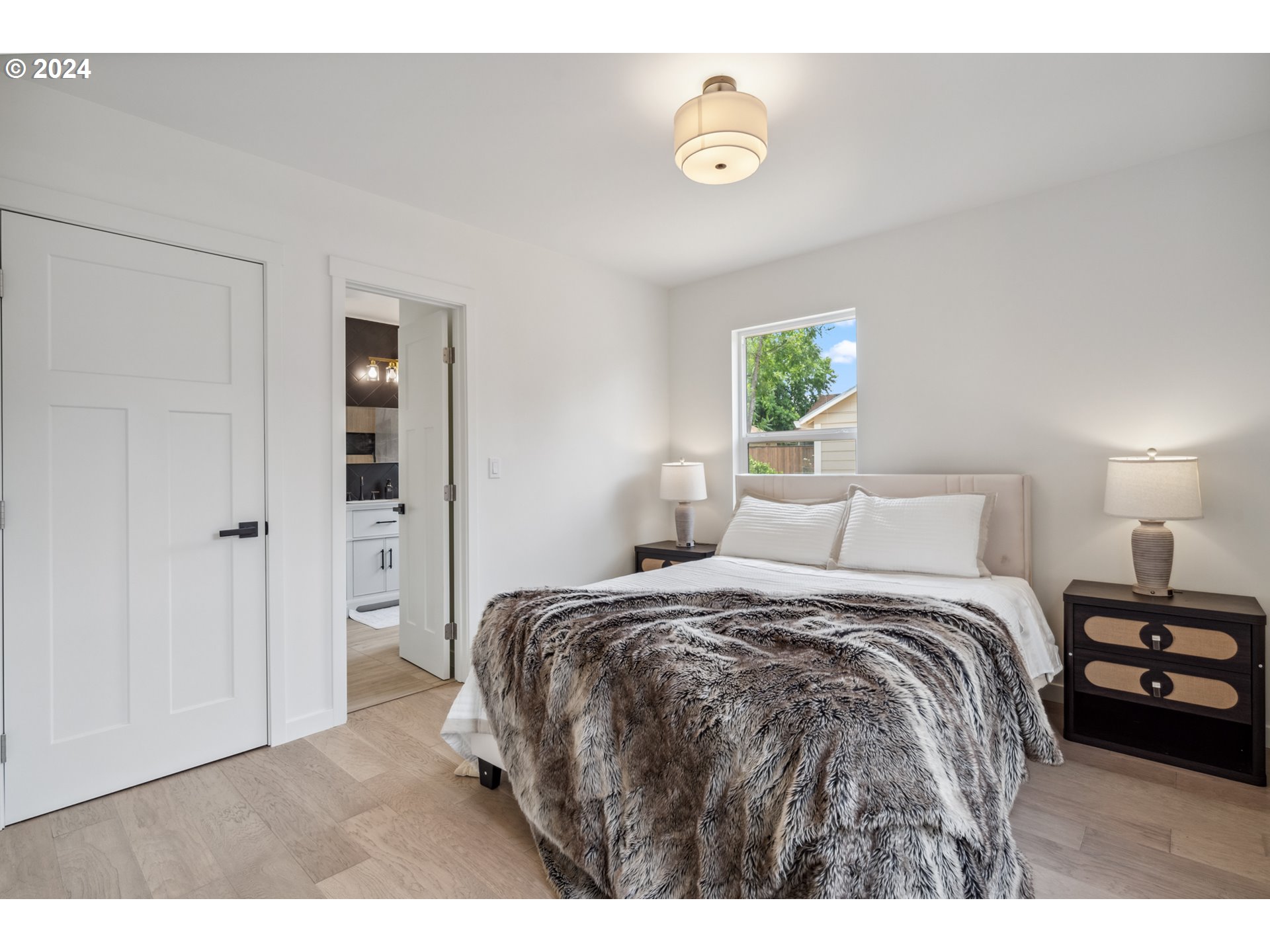 2904 R Street Vancouver, WA 98663 - Photo 19 of 46 a bedroom with a bed and a window