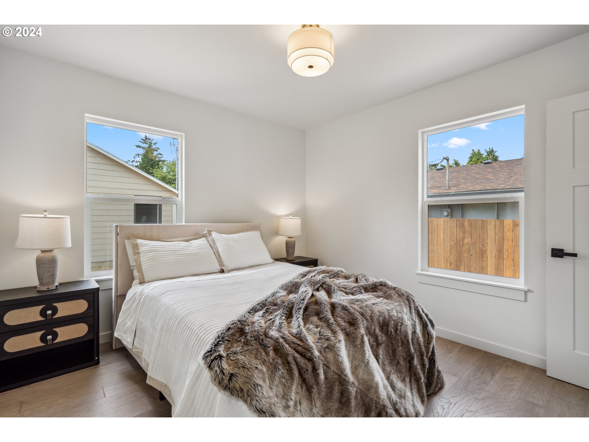 2904 R Street Vancouver, WA 98663 - Photo 20 of 46 a bedroom with a bed and a painting on the wall