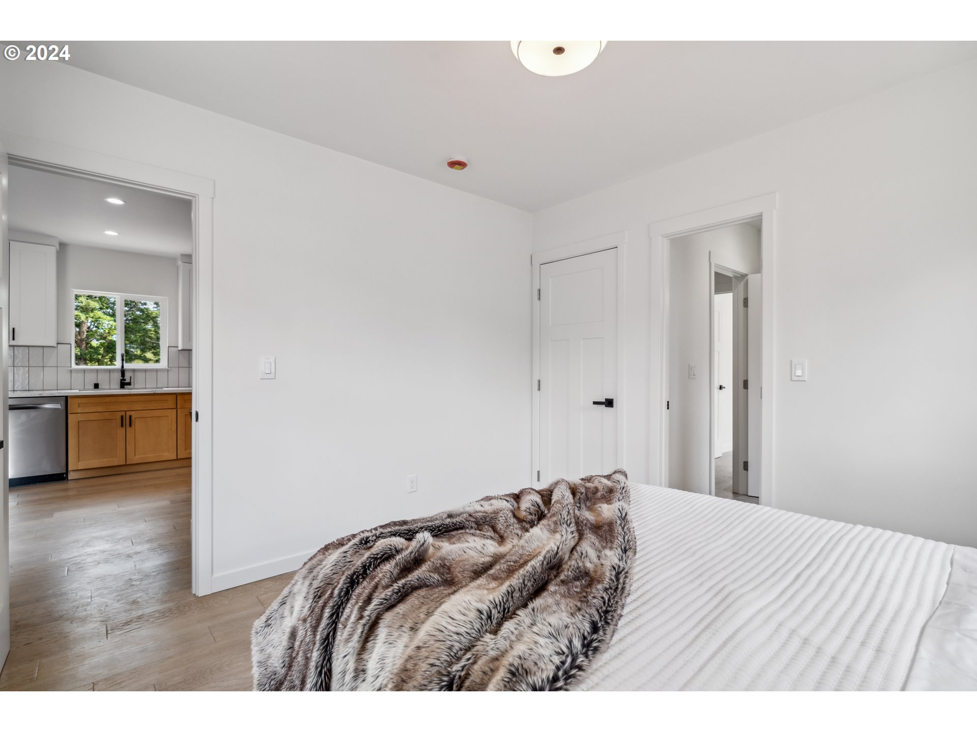 2904 R Street Vancouver, WA 98663 - Photo 21 of 46 a bedroom with a bed and wooden floor