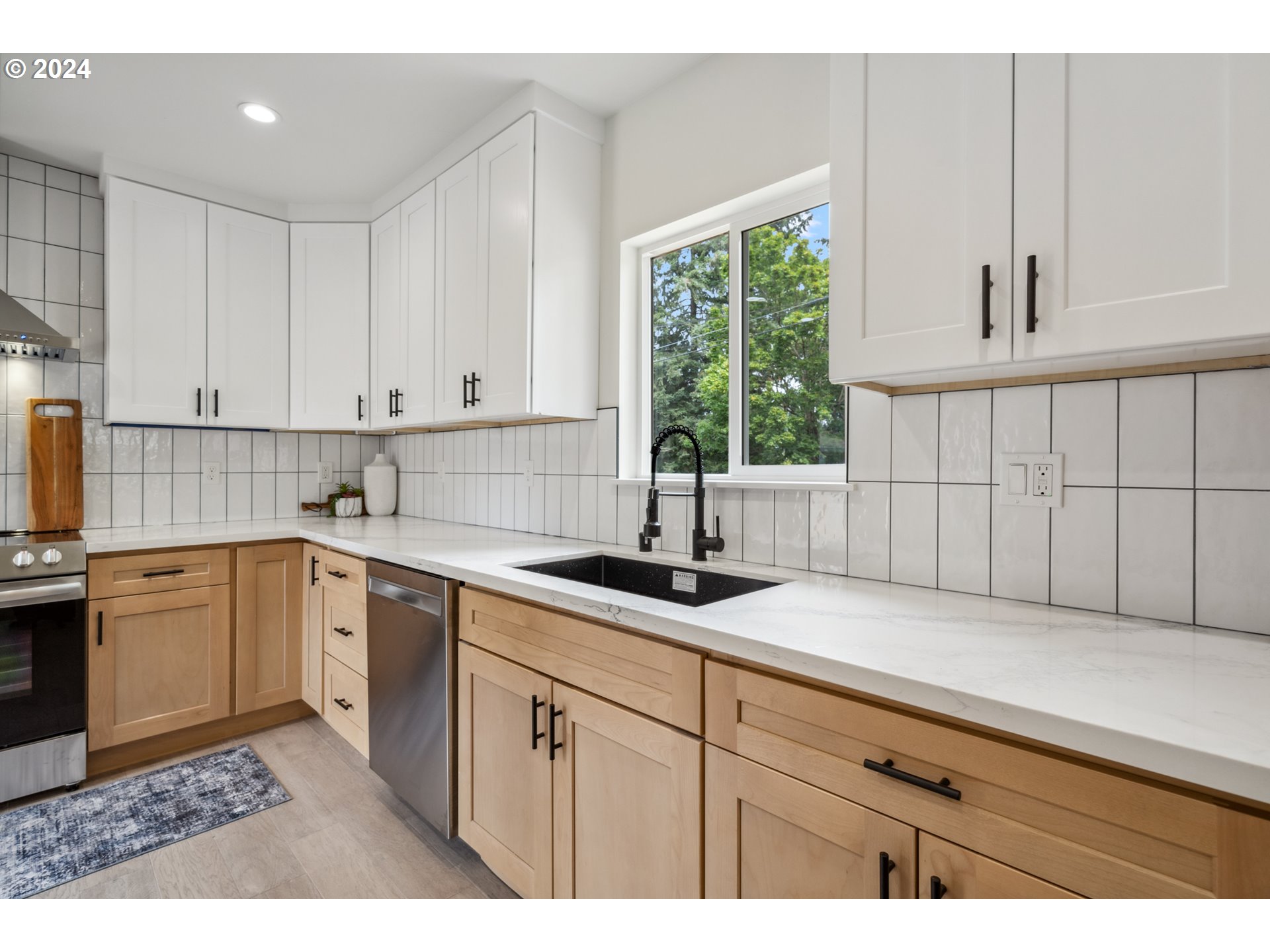 2904 R Street Vancouver, WA 98663 - Photo 8 of 46 a kitchen with granite countertop white cabinets white appliances and sink