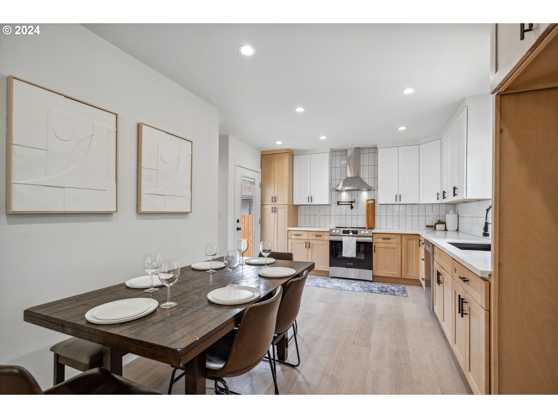 2904 R Street Vancouver, WA 98663 - Photo 10 of 46 a kitchen with a sink refrigerator and cabinets