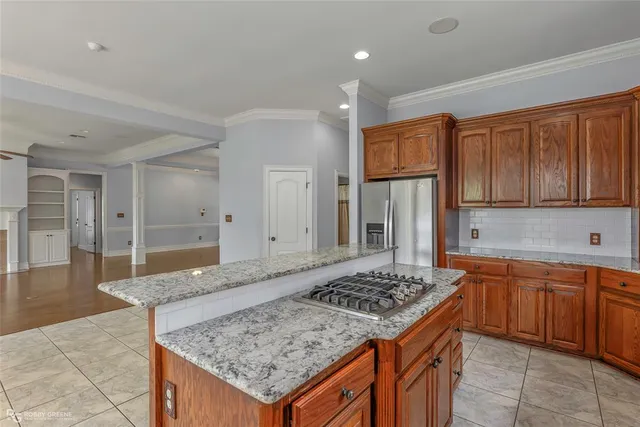 a kitchen with a sink stove and refrigerator