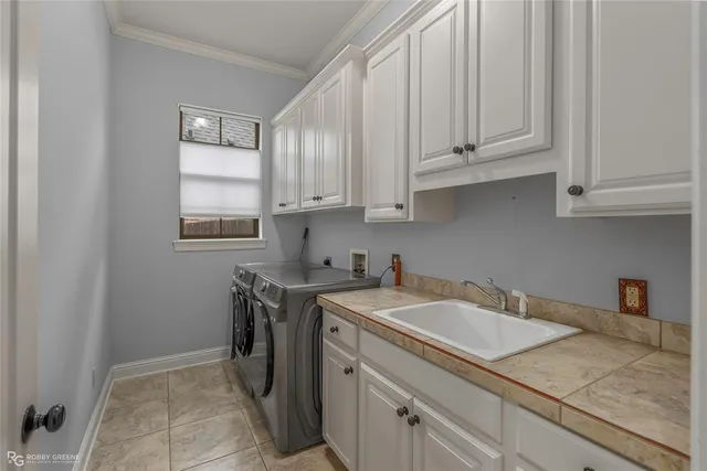 a view of a kitchen with sink and cabinets