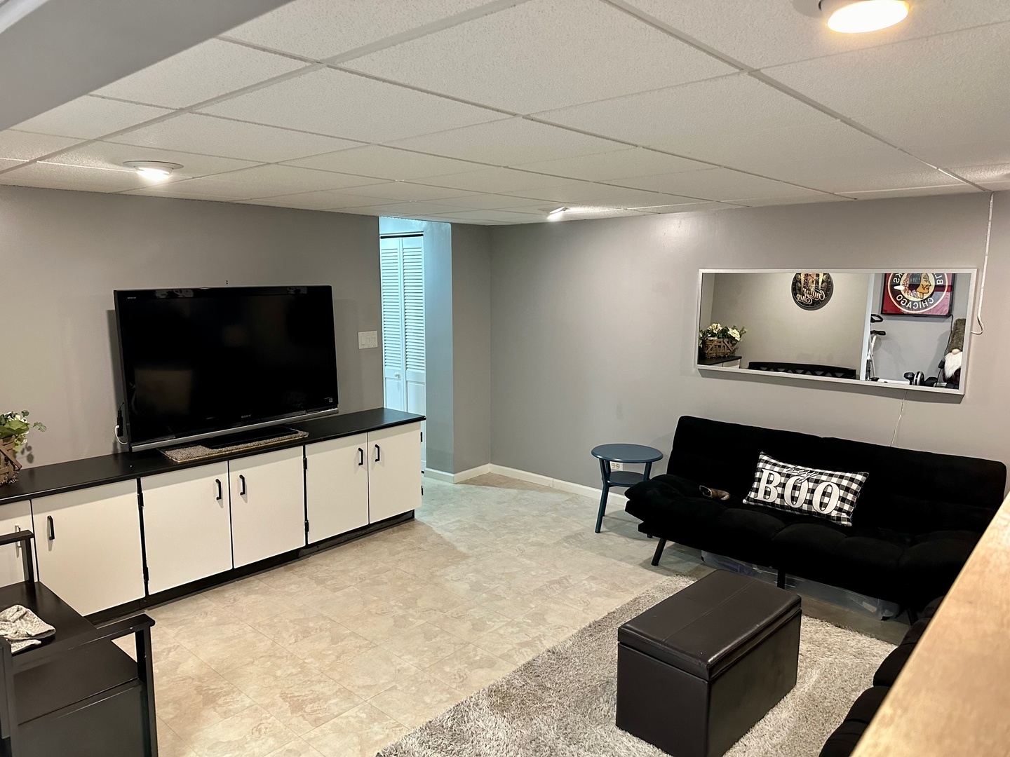 999 Confederation Drive Bartlett, IL 60103 - Photo 19 of 26 a living room with furniture and a flat screen tv