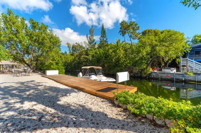 a view of a lake with a house in the background