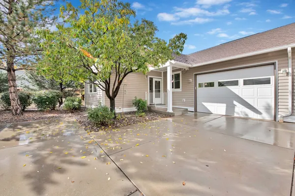 a view of a house with a tree