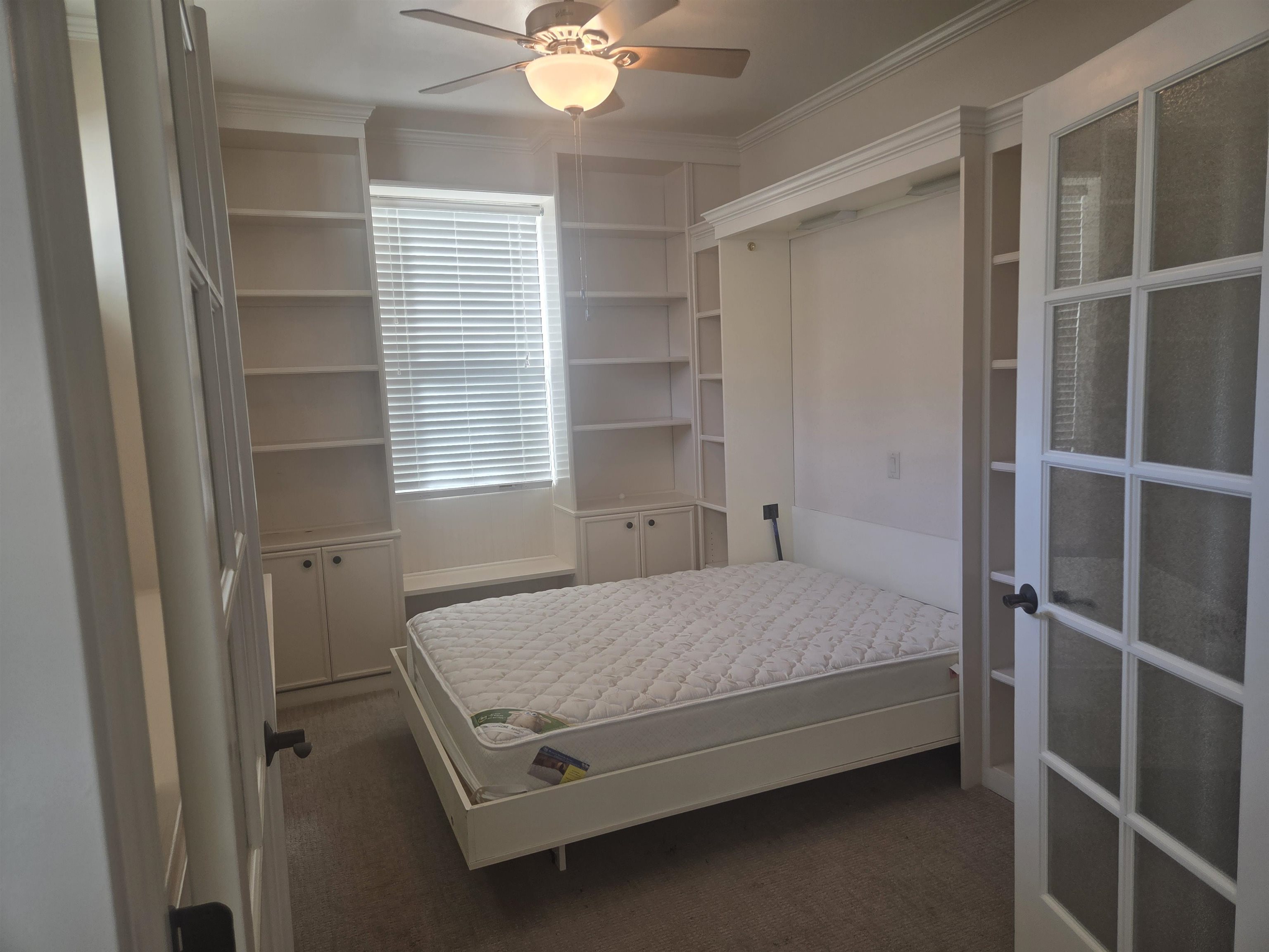 1112 Sunrose Lane, Unit 324 Fruita, CO 81521 - Photo 11 of 21 a bedroom with a bed and a window