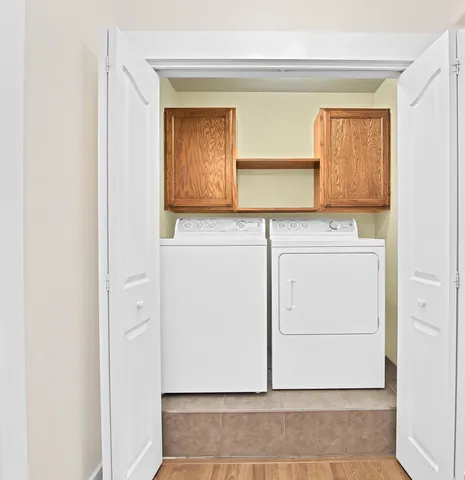 a bathroom with a granite countertop sink toilet a mirror and vanity