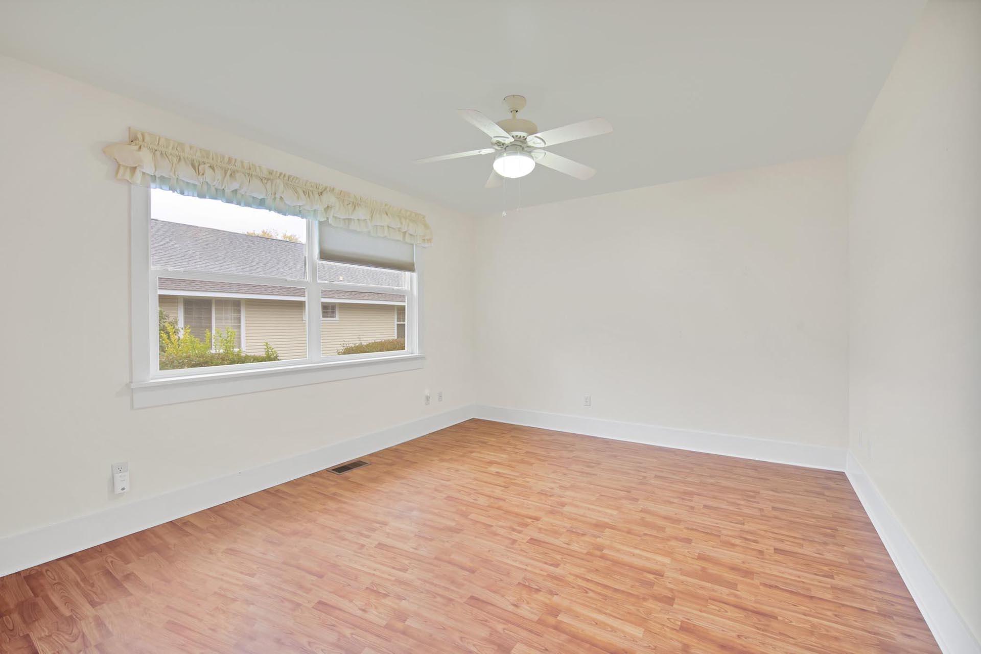 1112 Sunrose Lane, Unit 324 Fruita, CO 81521 - Photo 14 of 21 a view of empty room with wooden floor and fan