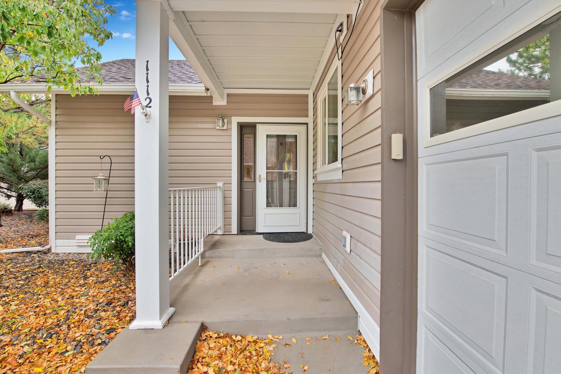 1112 Sunrose Lane, Unit 324 Fruita, CO 81521 - Photo 2 of 21 a view of a house with a door and pathway