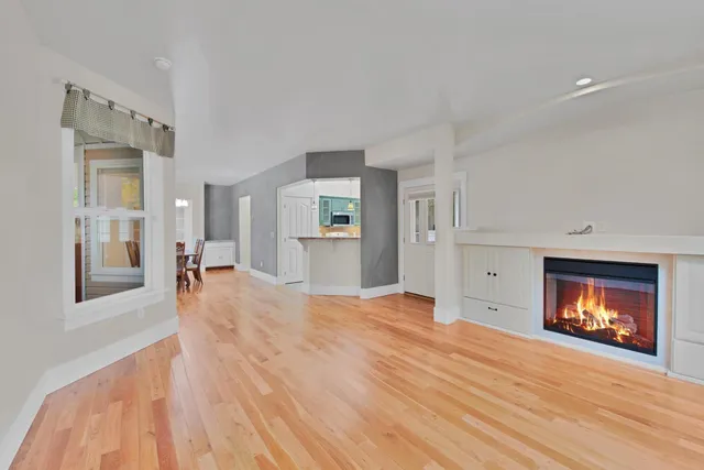 a kitchen with stainless steel appliances granite countertop a sink and cabinets