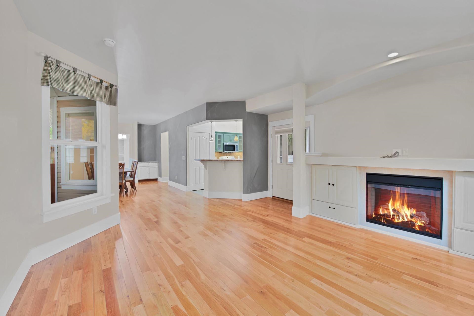 1112 Sunrose Lane, Unit 324 Fruita, CO 81521 - Photo 4 of 21 a view of empty room with a fireplace and wooden floor