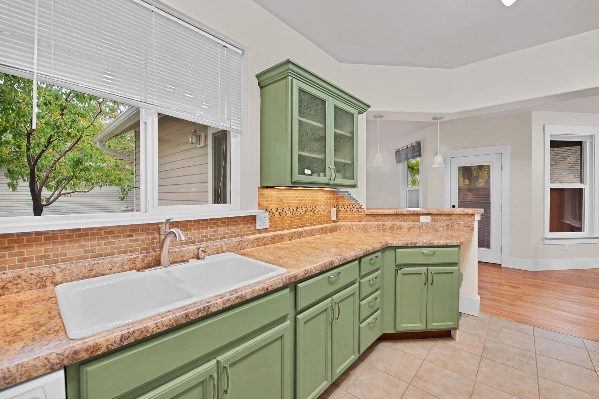 1112 Sunrose Lane, Unit 324 Fruita, CO 81521 - Photo 7 of 21 a kitchen with a sink and a large window