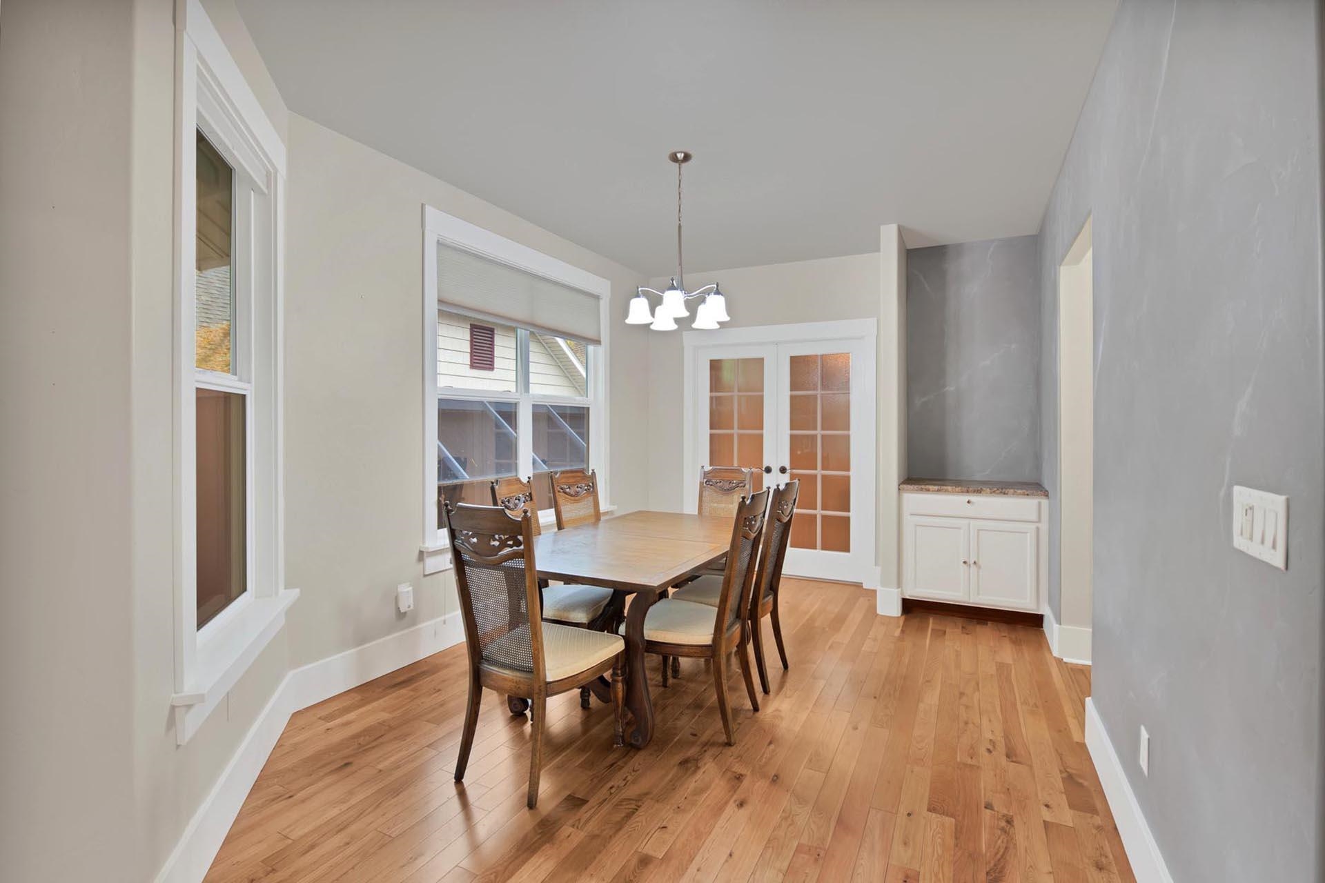 1112 Sunrose Lane, Unit 324 Fruita, CO 81521 - Photo 8 of 21 a view of a dining room with furniture window and wooden floor