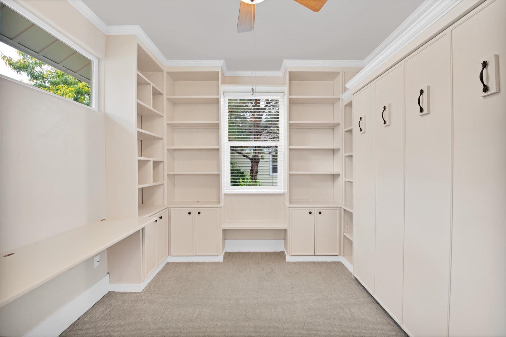 1112 Sunrose Lane, Unit 324 Fruita, CO 81521 - Photo 9 of 21 a view of an empty room with a window and cabinet
