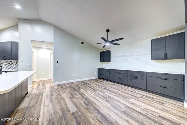a view of a kitchen with a sink and cabinet