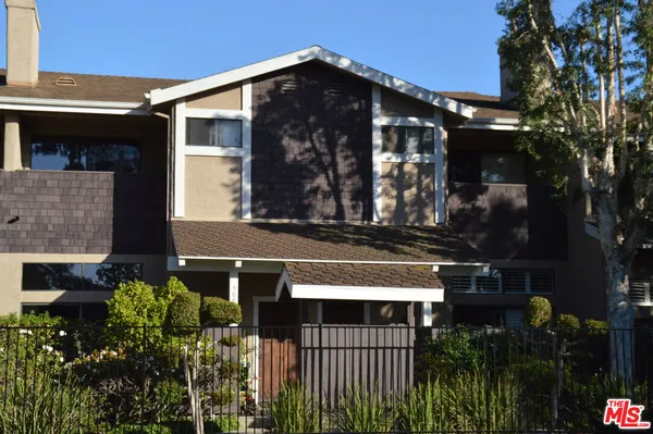 a front view of a house with parking