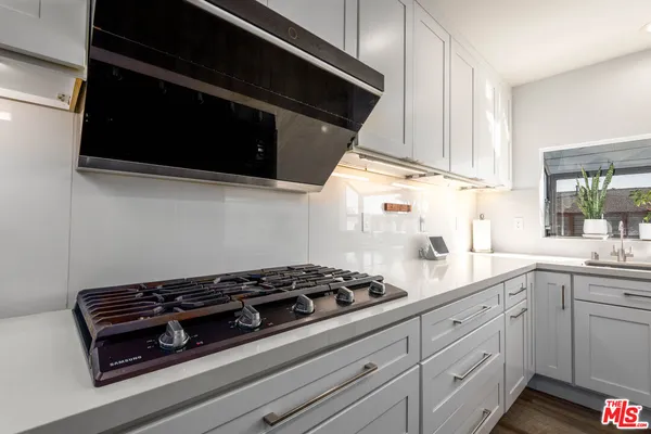 a kitchen with a stove and a microwave