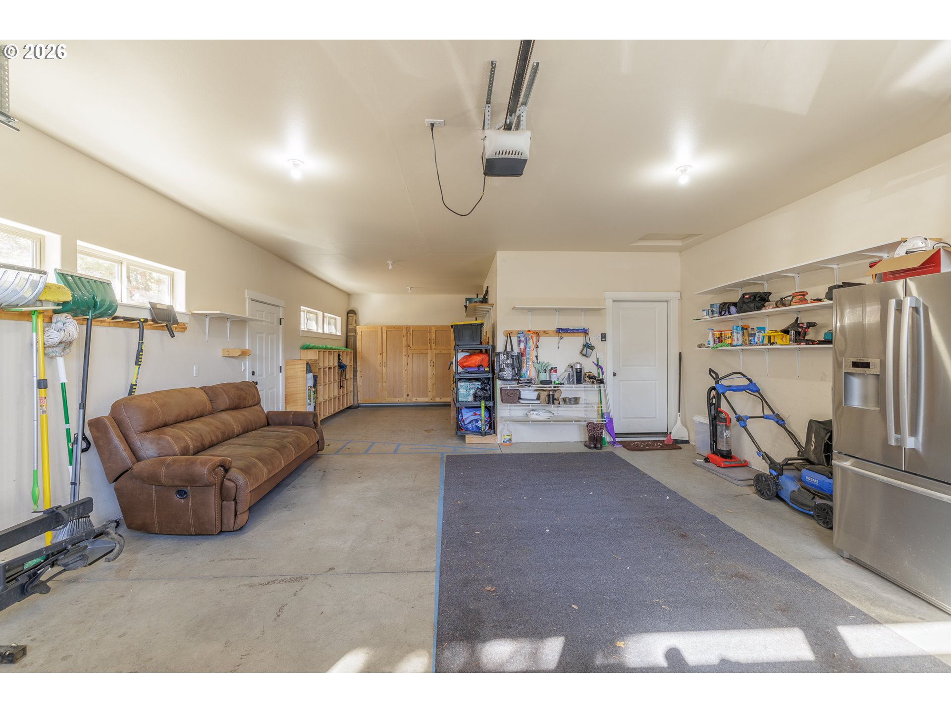 16802 Pony Express Way Bend, OR 97707 - Photo 32 of 37 a view of a livingroom with furniture and a garage