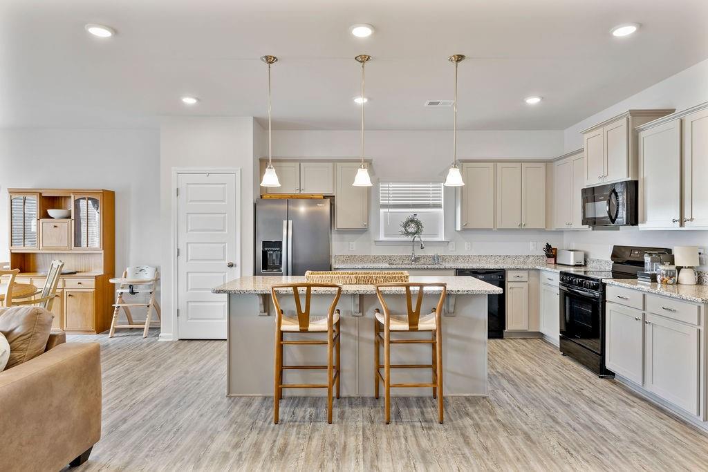 9 Mossy Oaks Lane Northeast Rome, GA 30165 - Photo 12 of 32 a large kitchen with a table and chairs in it