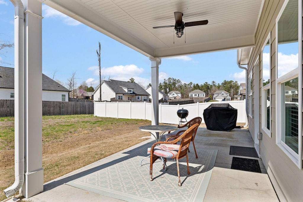 9 Mossy Oaks Lane Northeast Rome, GA 30165 - Photo 17 of 32 a living room with table chairs and a rug