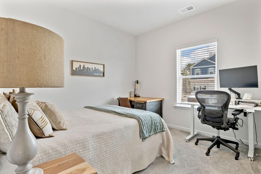9 Mossy Oaks Lane Northeast Rome, GA 30165 - Photo 18 of 32 a bedroom with a bed and a desk