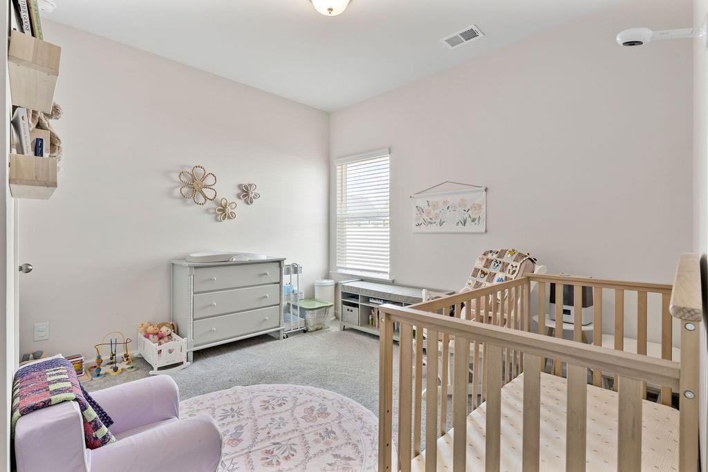 9 Mossy Oaks Lane Northeast Rome, GA 30165 - Photo 20 of 32 a bedroom with furniture and a window