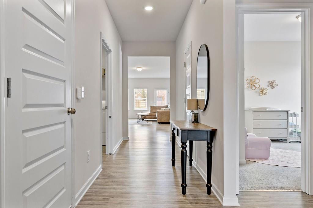 9 Mossy Oaks Lane Northeast Rome, GA 30165 - Photo 22 of 32 a view of a hallway with wooden floor and furniture