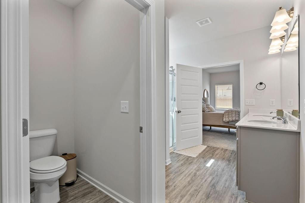 9 Mossy Oaks Lane Northeast Rome, GA 30165 - Photo 24 of 32 a bathroom with a sink a toilet and shower