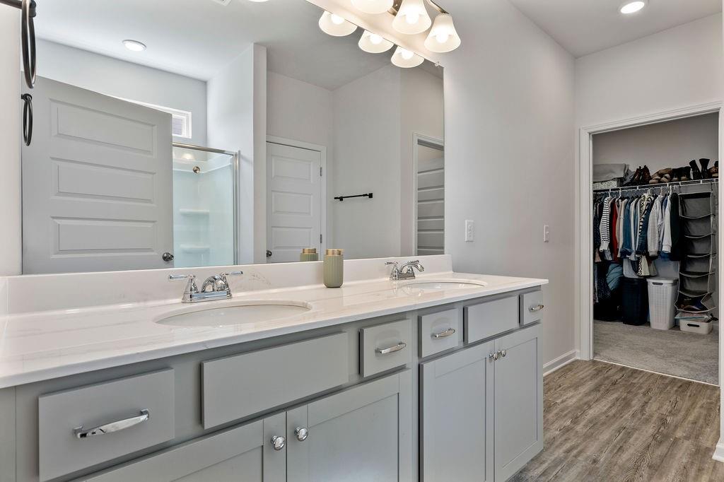9 Mossy Oaks Lane Northeast Rome, GA 30165 - Photo 26 of 32 a spacious bathroom with a double vanity sink double and a mirror