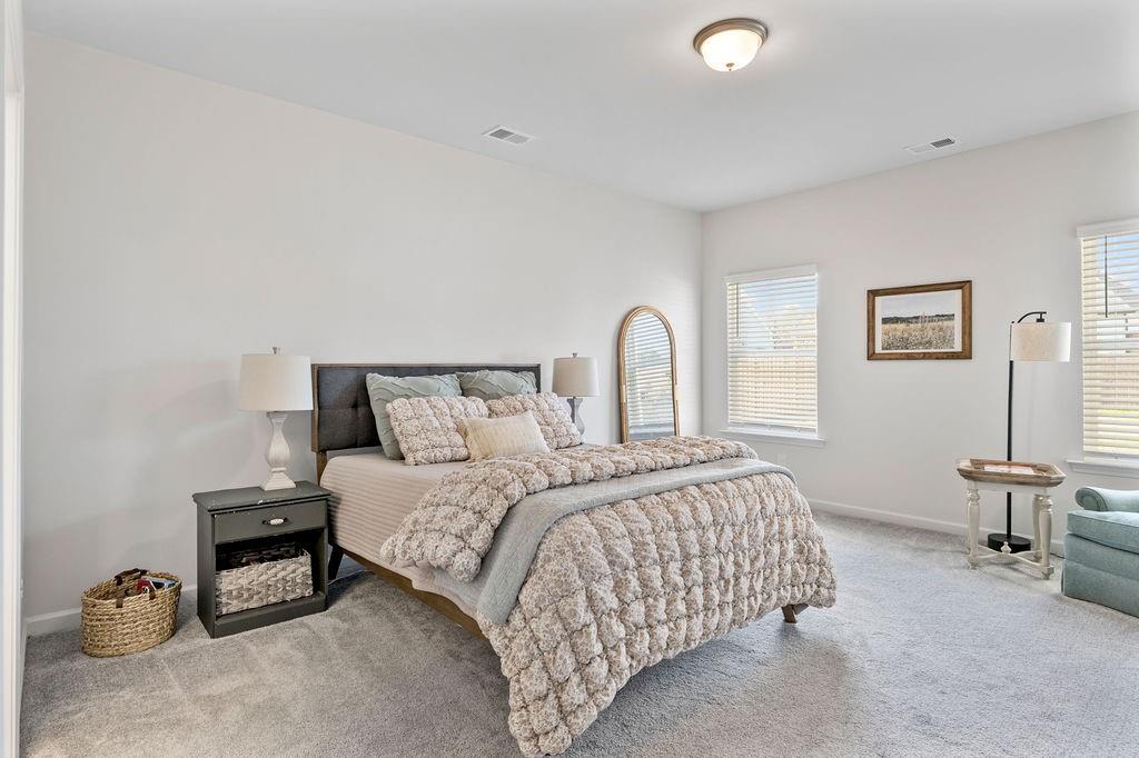 9 Mossy Oaks Lane Northeast Rome, GA 30165 - Photo 28 of 32 a bedroom with a bed and a lamp