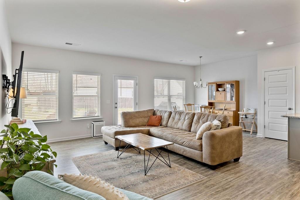 9 Mossy Oaks Lane Northeast Rome, GA 30165 - Photo 30 of 32 a living room with furniture and a potted plant