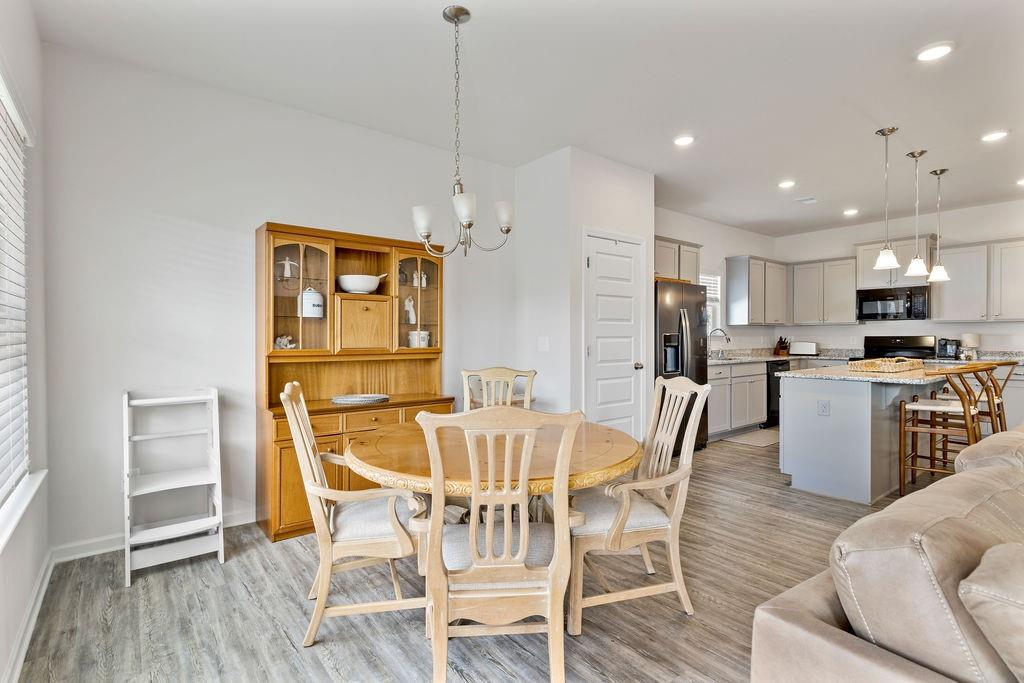 9 Mossy Oaks Lane Northeast Rome, GA 30165 - Photo 9 of 32 a view of a dining room with furniture wooden floor and chandelier