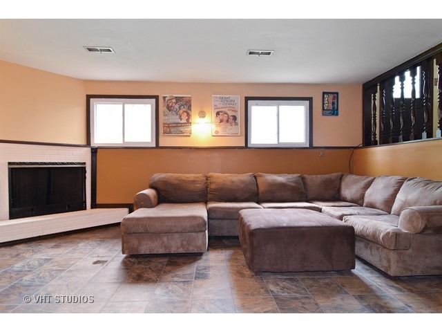 515 Redwood Road Bolingbrook, IL 60440 - Photo 8 of 15 a living room with furniture and a fireplace