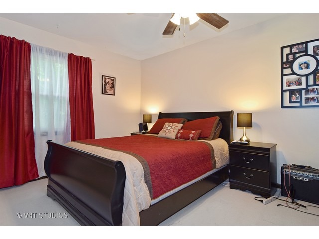 515 Redwood Road Bolingbrook, IL 60440 - Photo 10 of 15 a bedroom with a bed dresser and a window