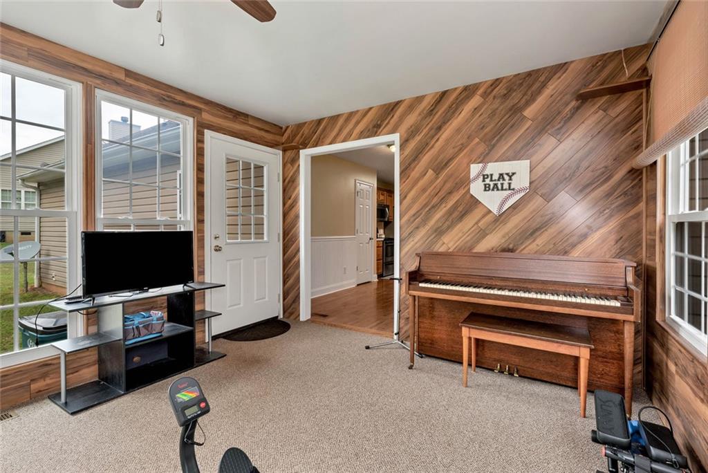 1044 Lothridge Road Cleveland, GA 30528 - Photo 21 of 40 a living room with furniture and a flat screen tv