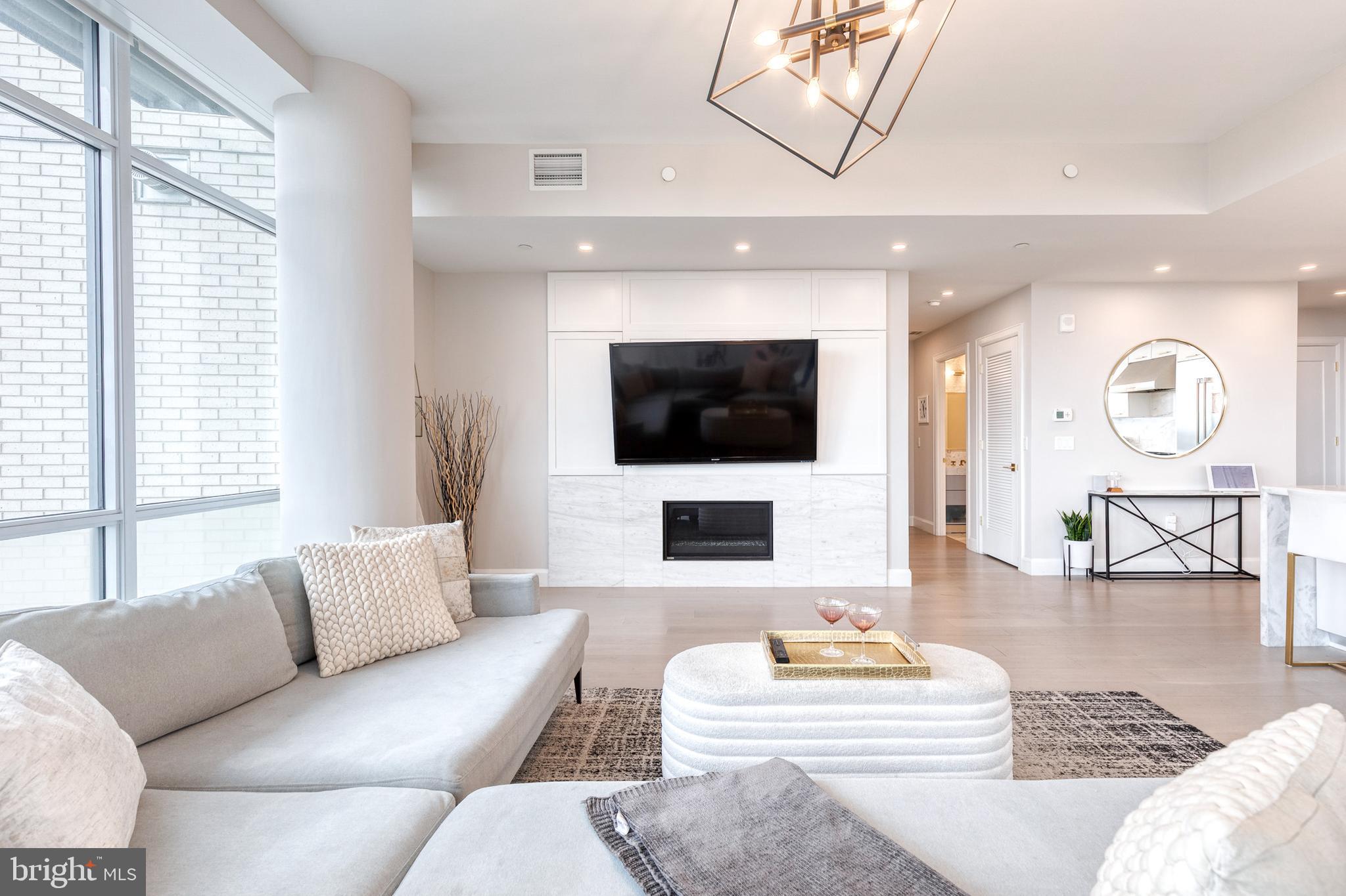 1330 Lancaster Street, Unit C701 Baltimore, MD 21231 - Photo 13 of 73 a living room with furniture and a flat screen tv