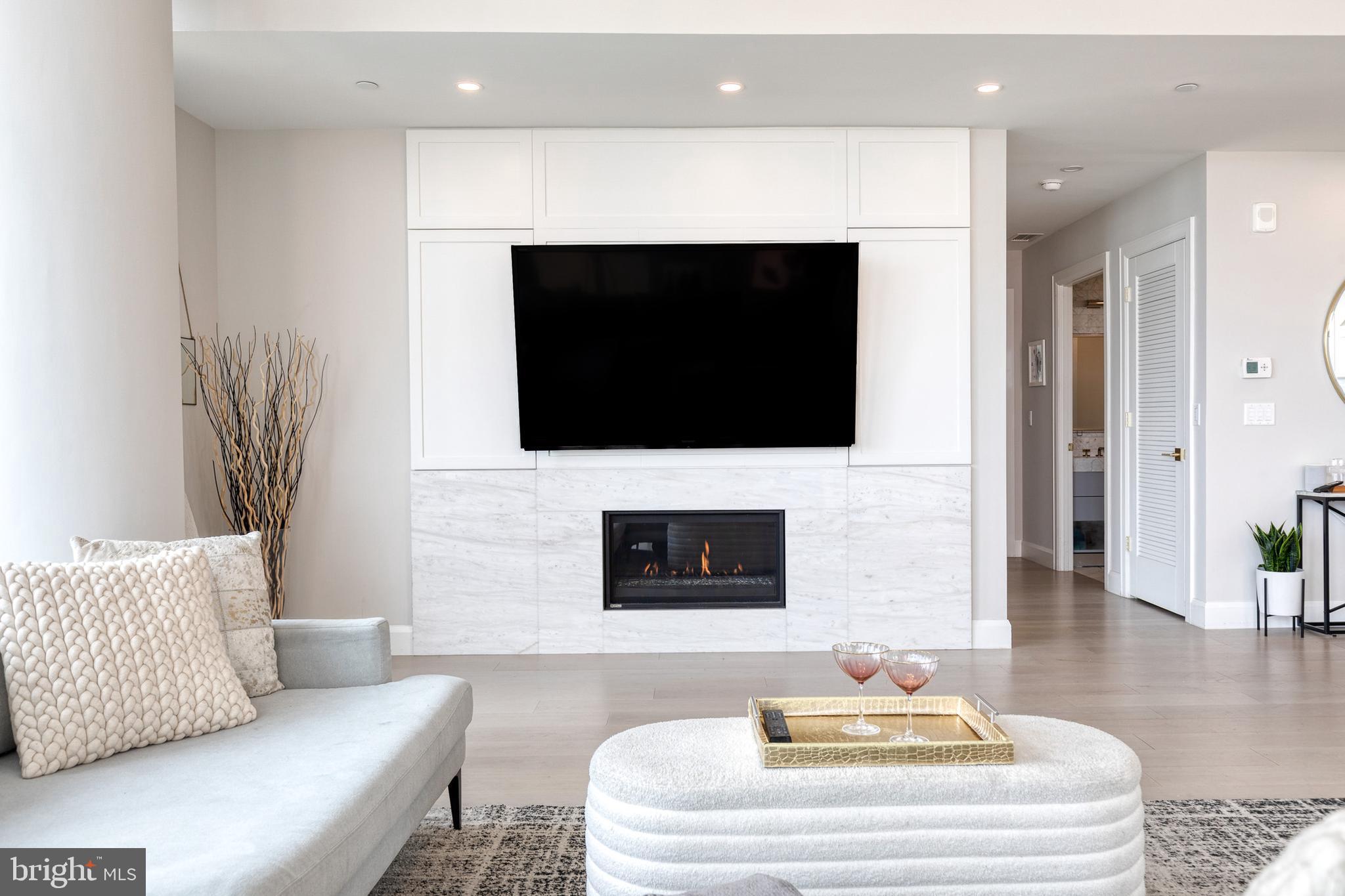 1330 Lancaster Street, Unit C701 Baltimore, MD 21231 - Photo 15 of 73 a living room with a couch and a flat screen tv