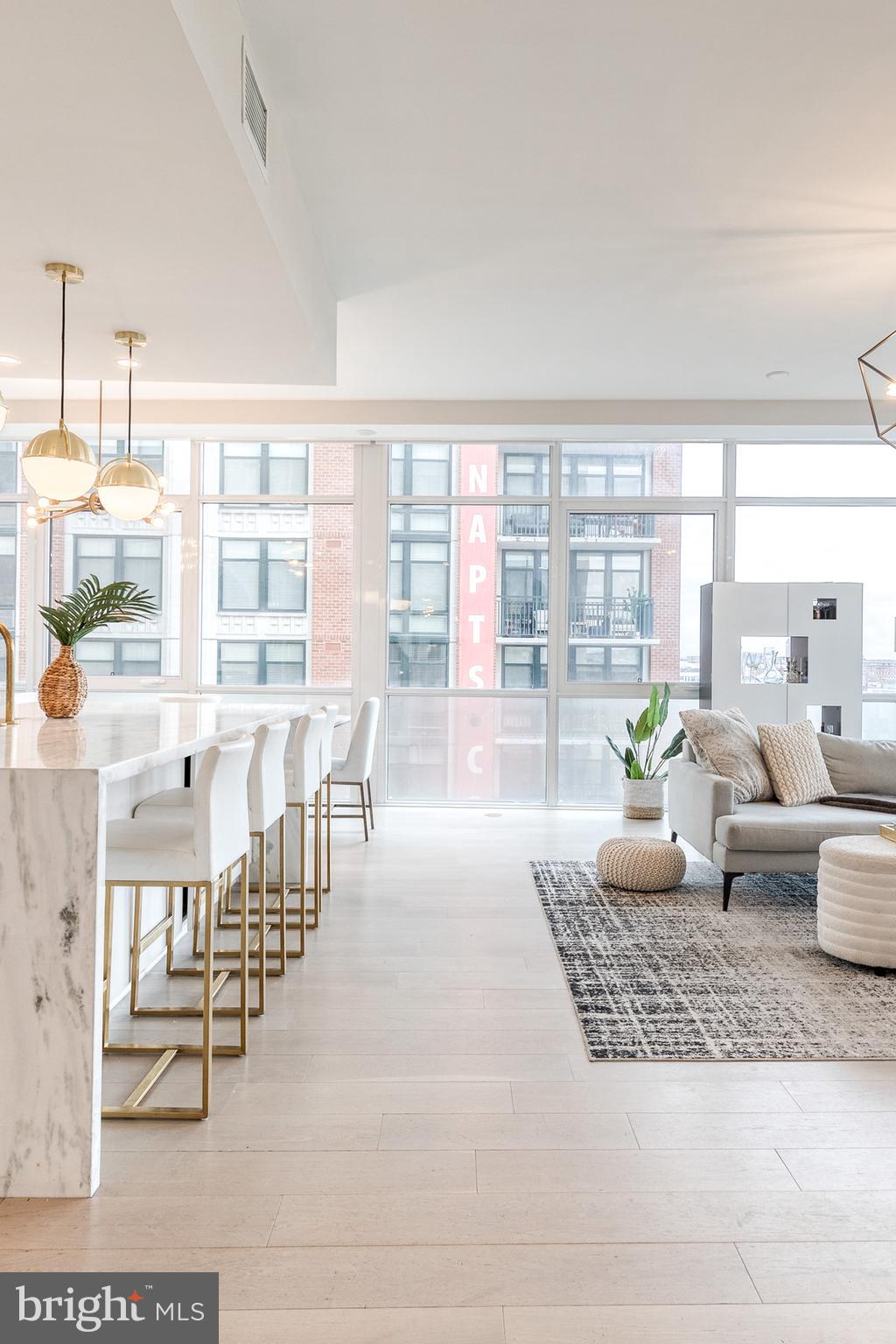 1330 Lancaster Street, Unit C701 Baltimore, MD 21231 - Photo 28 of 73 a living room with furniture and a large window