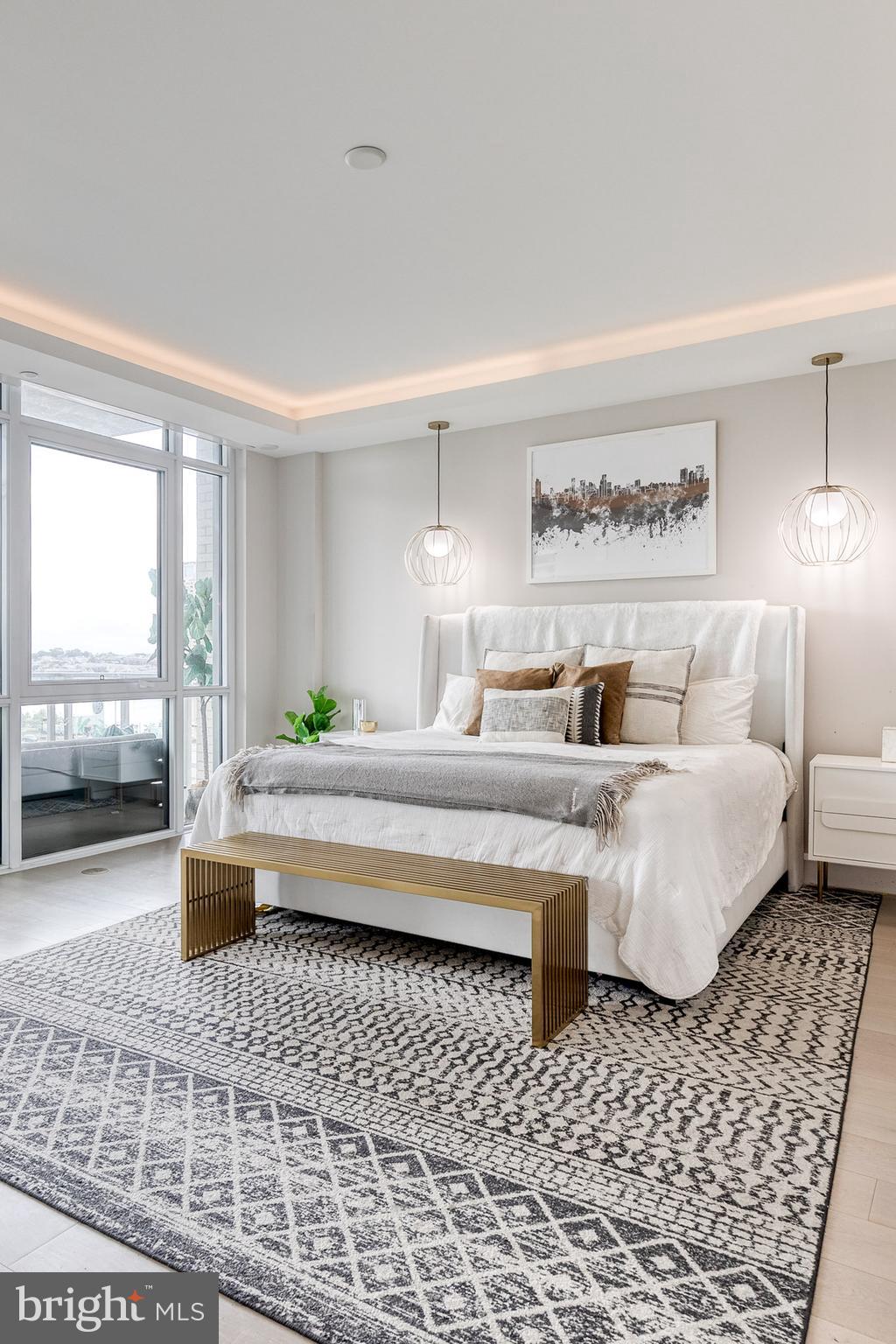 1330 Lancaster Street, Unit C701 Baltimore, MD 21231 - Photo 30 of 73 a bedroom with a large bed and a window