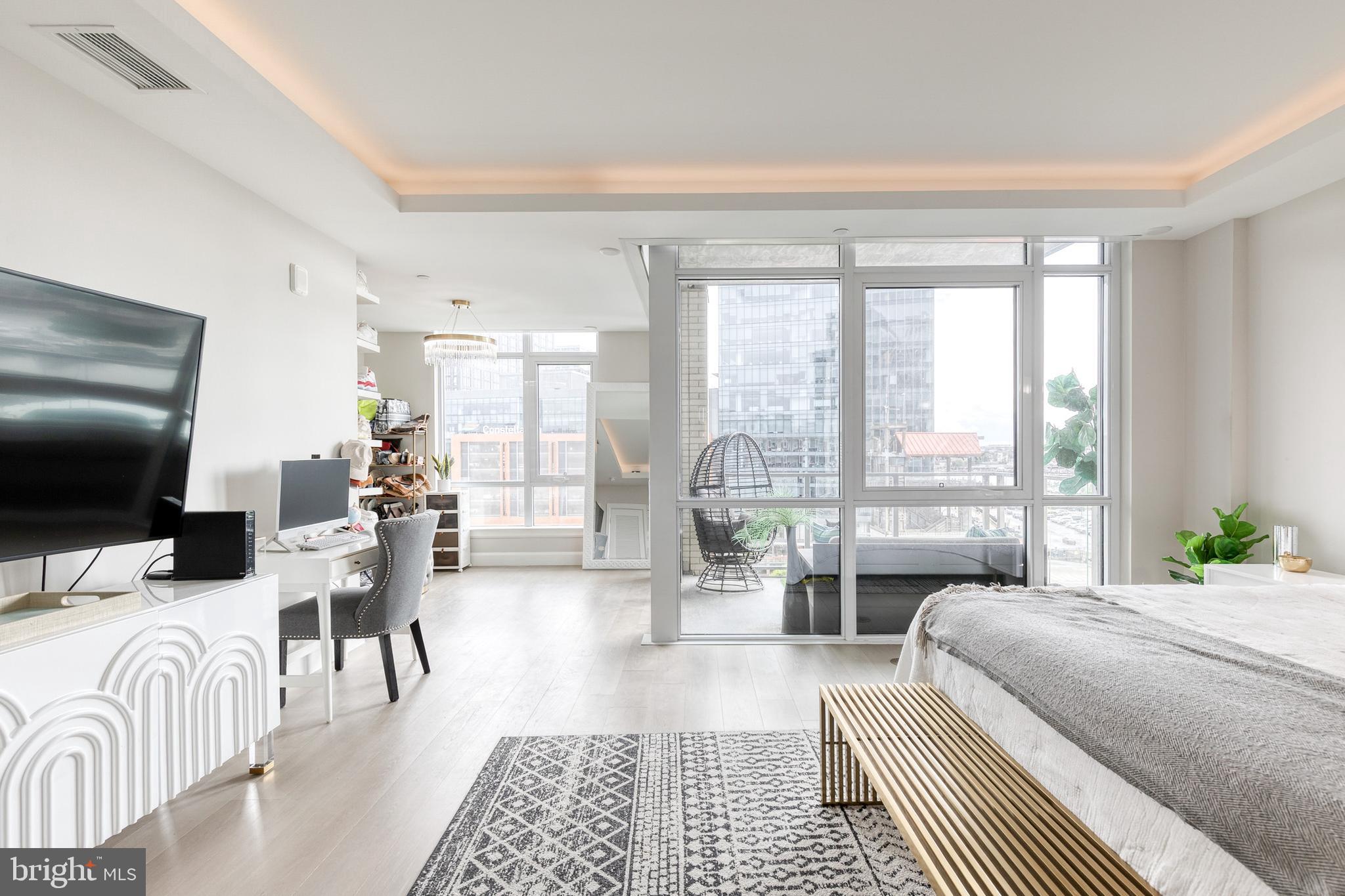 1330 Lancaster Street, Unit C701 Baltimore, MD 21231 - Photo 31 of 73 a bedroom with furniture and a large window