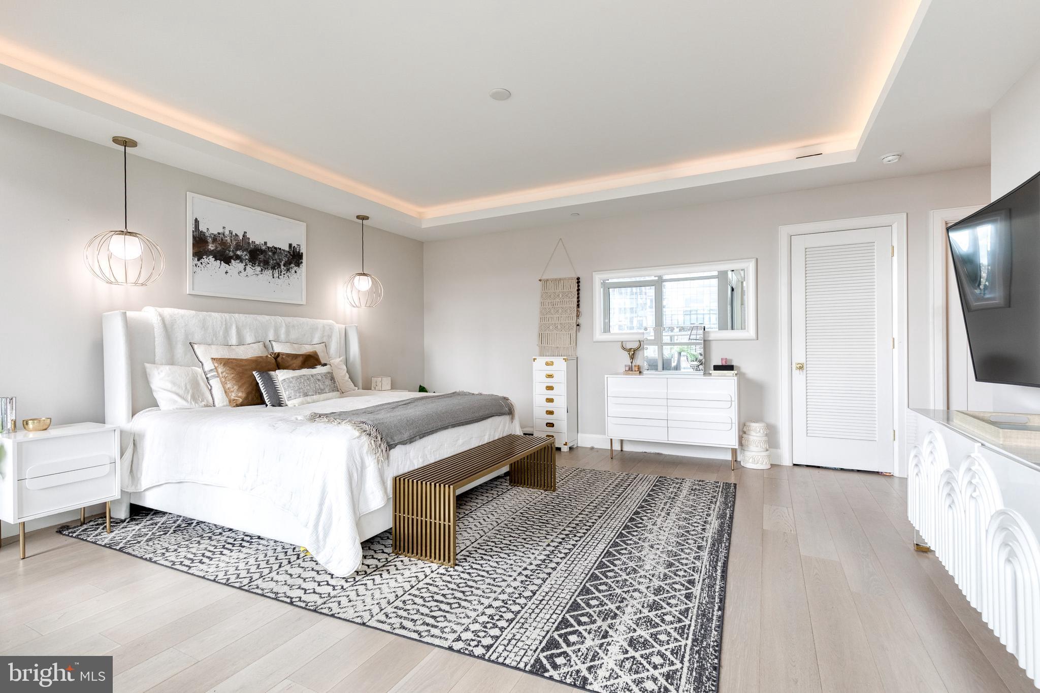 1330 Lancaster Street, Unit C701 Baltimore, MD 21231 - Photo 33 of 73 a bedroom with a large bed and a window