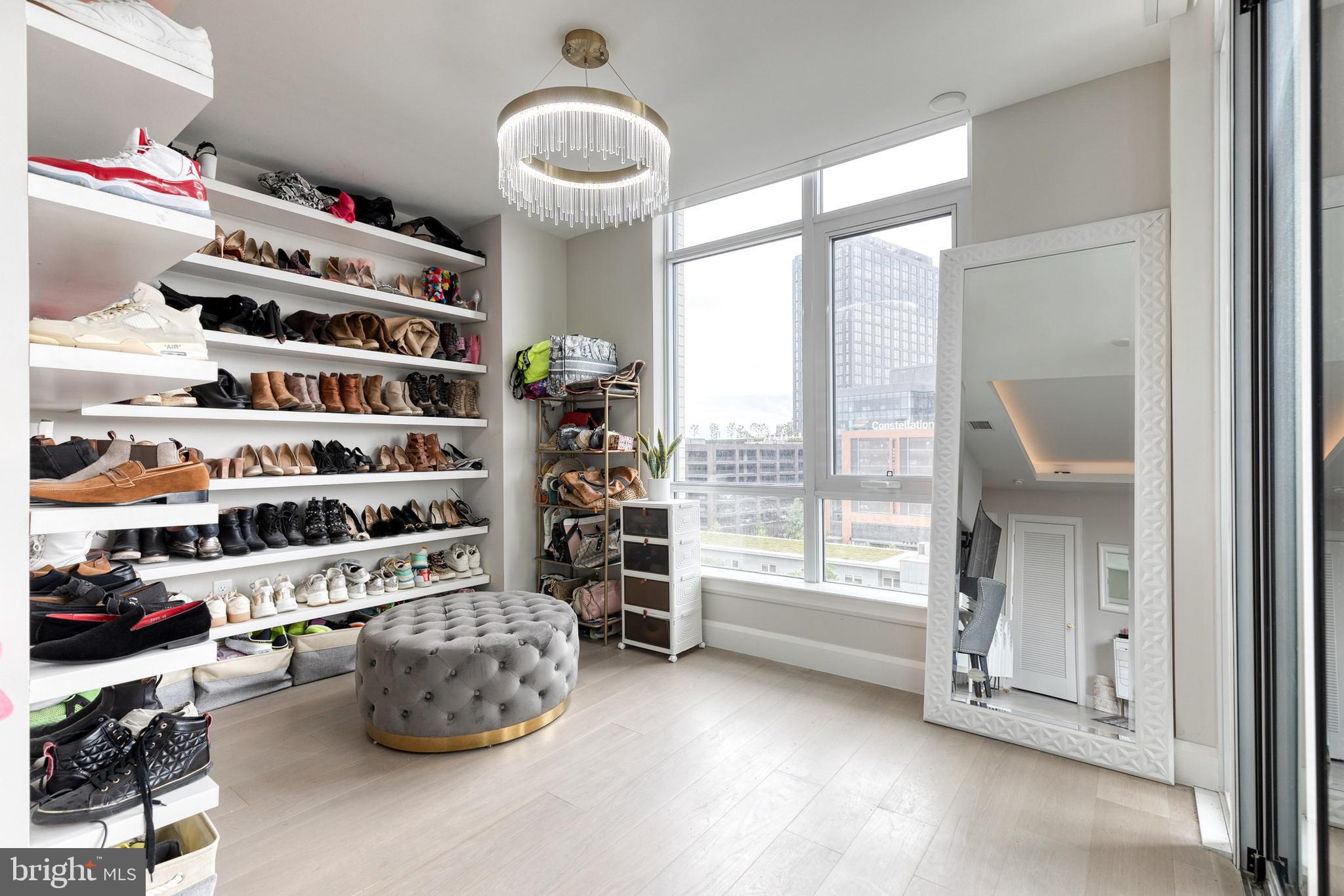 1330 Lancaster Street, Unit C701 Baltimore, MD 21231 - Photo 36 of 73 a room with a cabinet and a large window