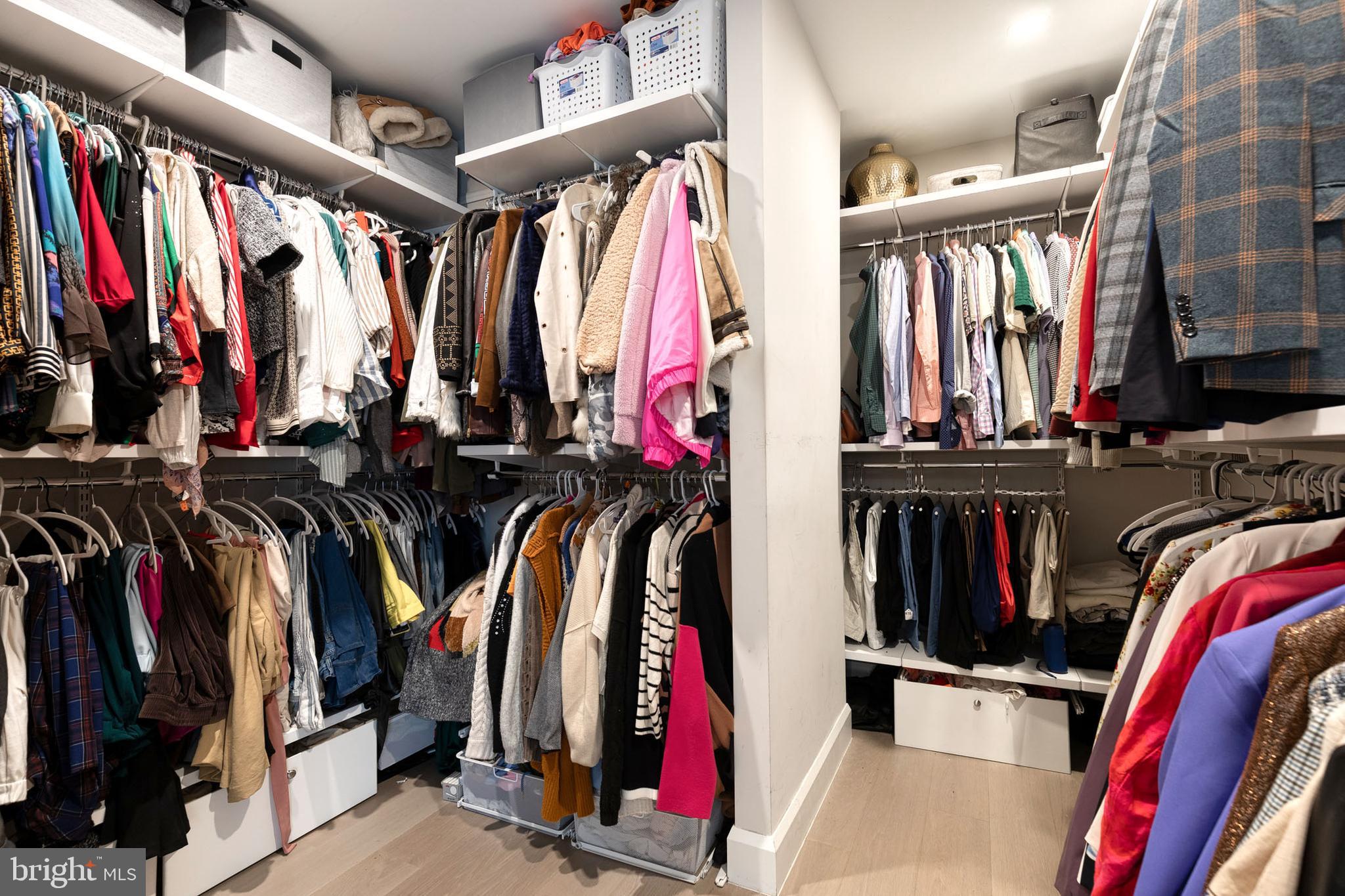 1330 Lancaster Street, Unit C701 Baltimore, MD 21231 - Photo 41 of 73 a view of walk in closet with clothes