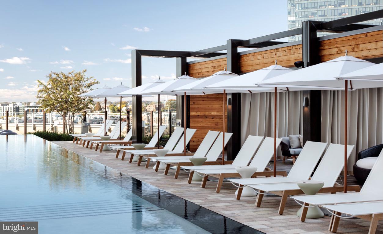1330 Lancaster Street, Unit C701 Baltimore, MD 21231 - Photo 68 of 73 a view of a patio with swimming pool table and chairs