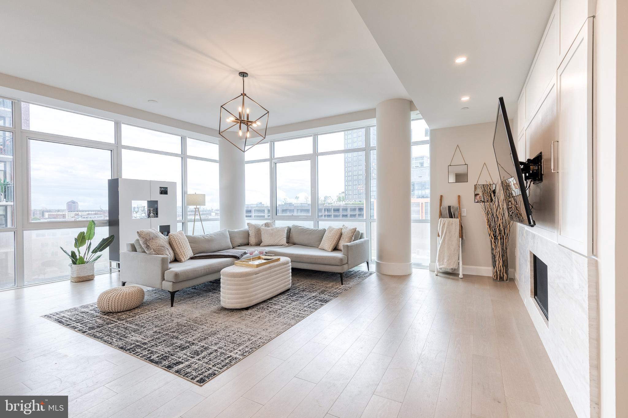 1330 Lancaster Street, Unit C701 Baltimore, MD 21231 - Photo 7 of 73 a living room with furniture and a floor to ceiling window