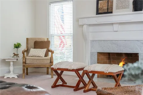 a view of a dining room with furniture and chandelier