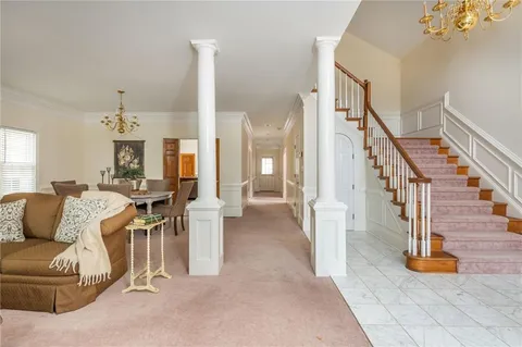 a large kitchen with stainless steel appliances sink a microwave and cabinets
